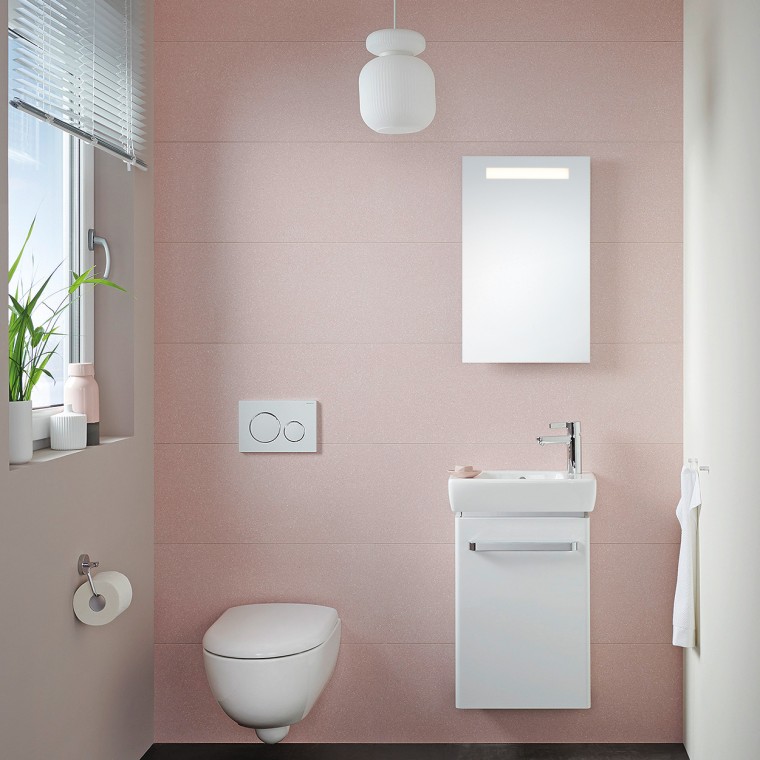 Liten gästtoalett med kompakt möbelskåp och vägghängd WC Liten gästtoalett med kompakt möbelskåp och vägghängd WC